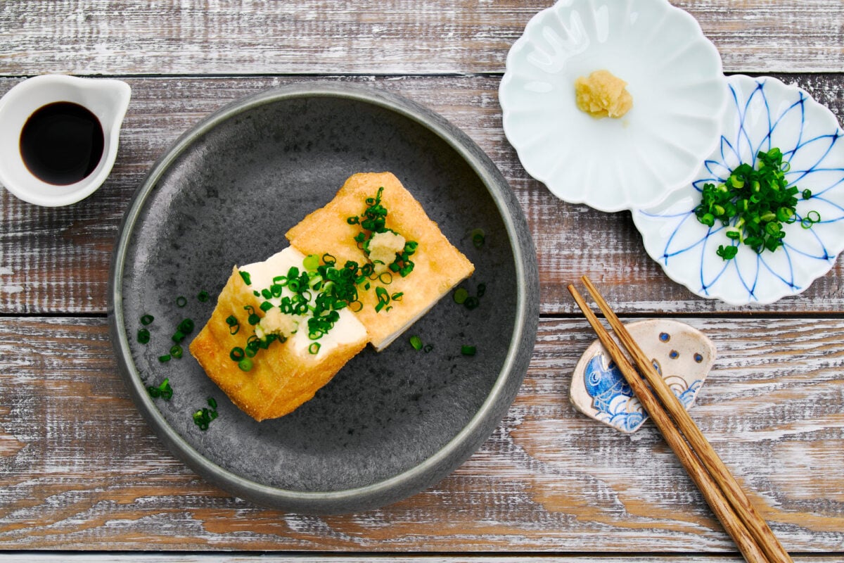 Japanese crispy fried tofu or atsuaage is a delicious appetizer with scallions, ginger, and soy sauce, or it can be used as a plant-based protein in stews and stir-fries.