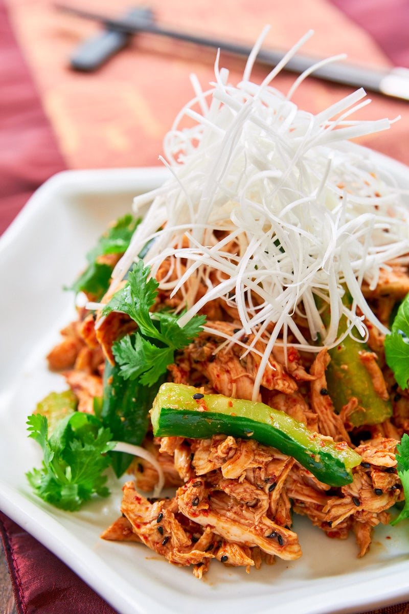 With tender poached and shredded chicken in a spicy sesame chili sauce, this Bang Bang Chicken is a mouthwatering chicken salad that's perfect for summer.