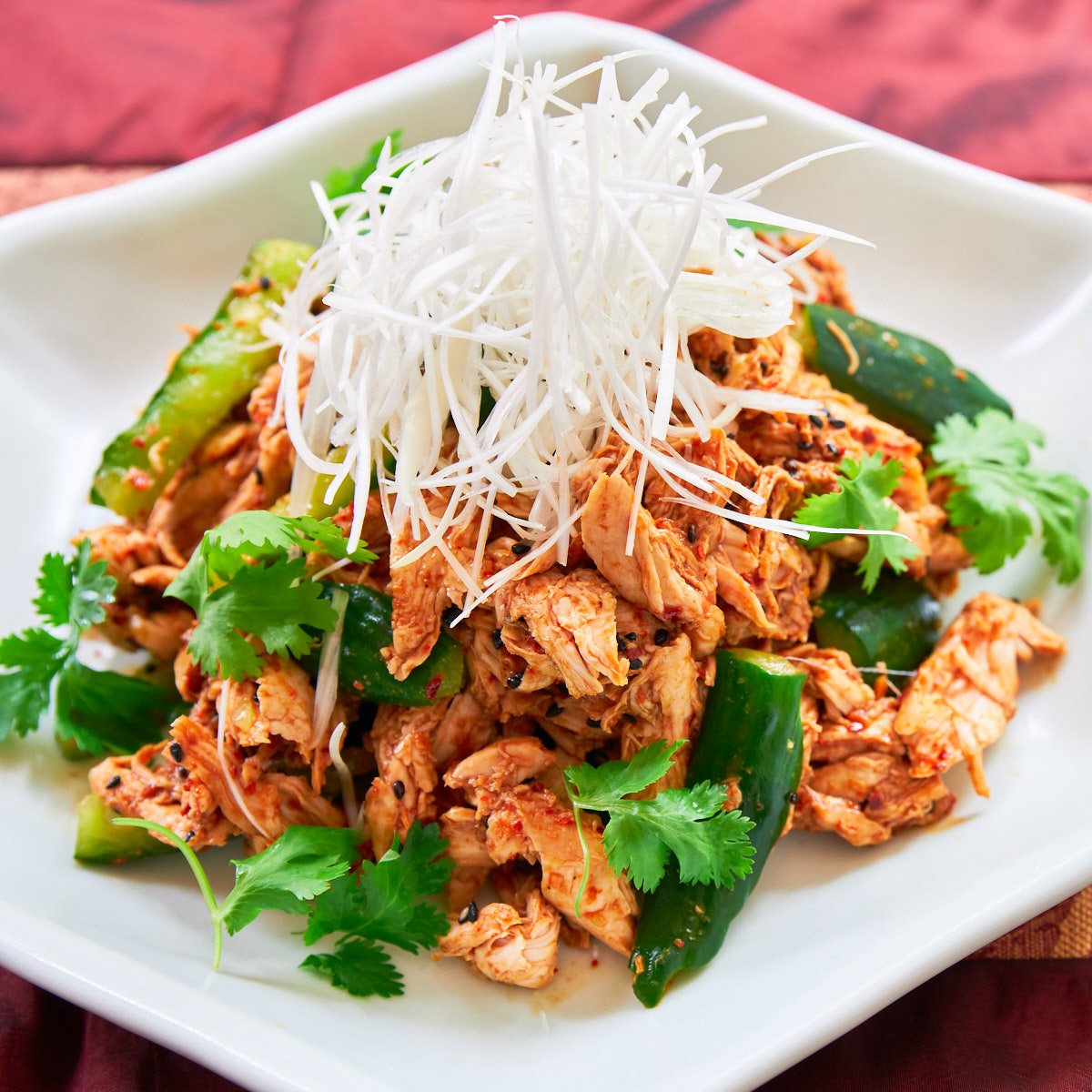 This spicy chicken salad is loaded with juicy shredded chicken and crunchy cucumbers dressed with a sesame chili sauce. Get the details in this Bang Bang Chicken recipe.