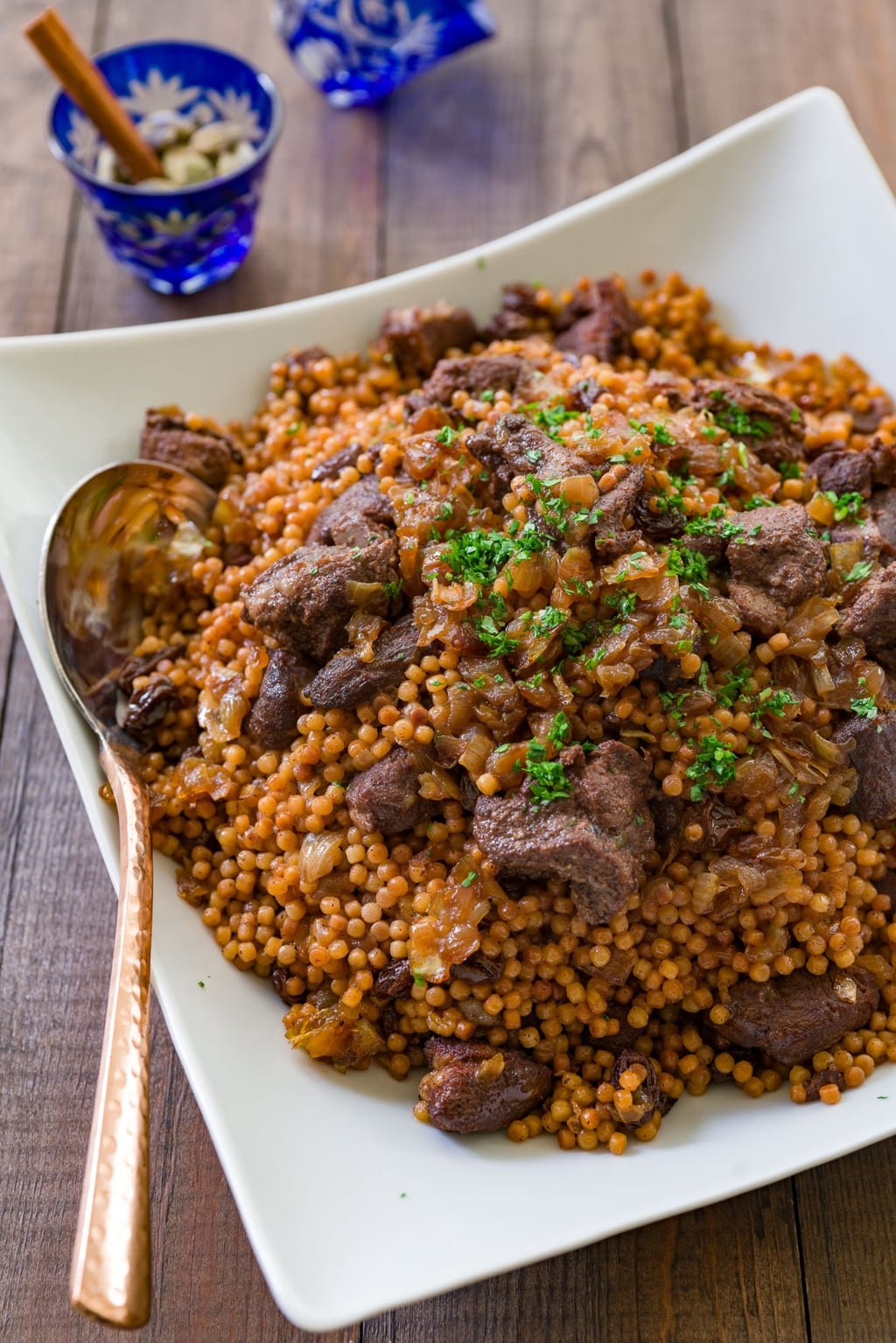 Braised lamb with caramelized onions, raisins and Israeli couscous.