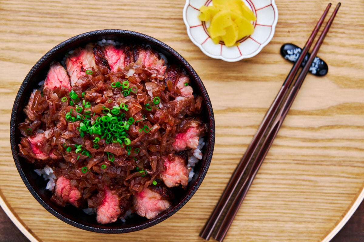 With tender juicy steak topped with onioned sauteed with red wine and soy sauce, this Chaliapin Steak recipe is a classic Japanese dish featured in Food Wars.