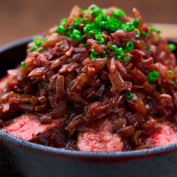 In Chaliapin Steak, onions are used to tenderize beef before it's grilled and topped with onions sauteed with red wine.