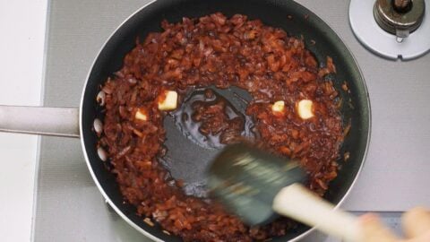 Butter being emulsified in the onion sauce for Chaliapin Steak.