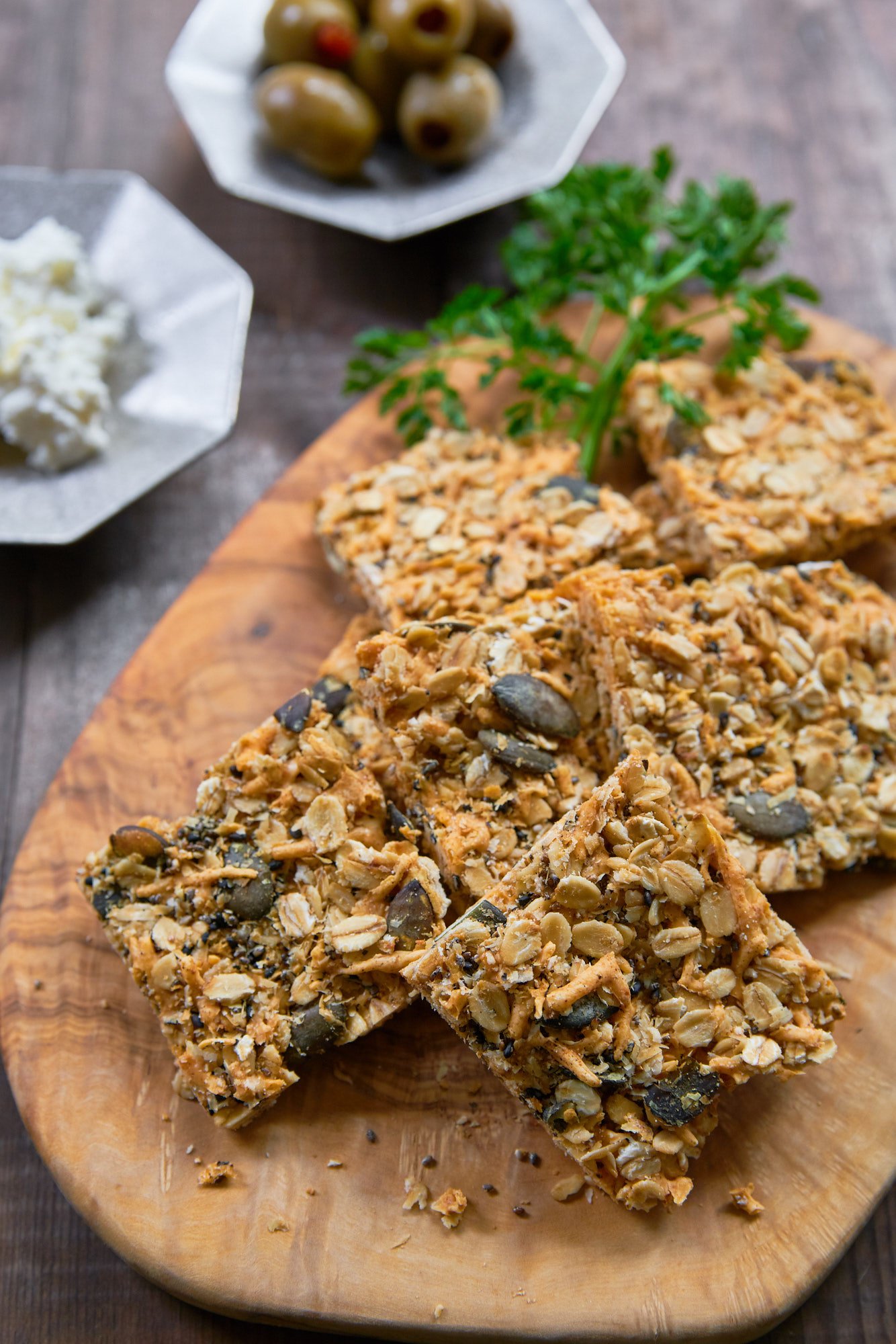 These cheesy savory granola bars taste like Cheez-Its but include the irresistable textures of oats, pumpkin seeds, sesame seeds, and chia seeds.