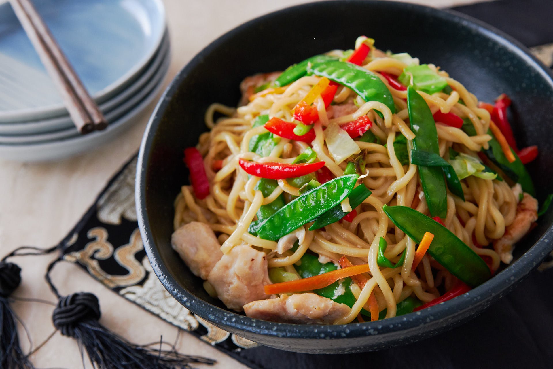 With a medley of fresh crisp veggies and juicy flavorful chicken, stir-fried with a tangle of savory noodles, this Chicken Chow Mein recipe is simply delicious.