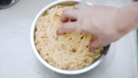 Rinsing Chow Mein noodles.