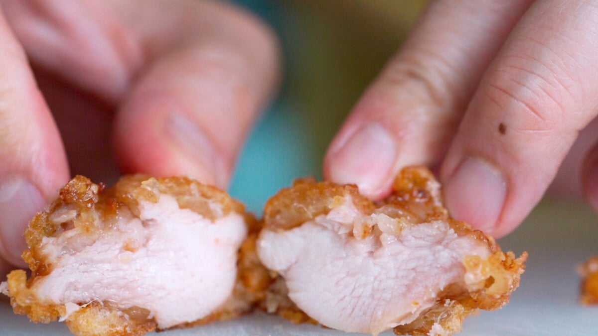 Karaage cut in half showing the crisp shell and juicy interior.