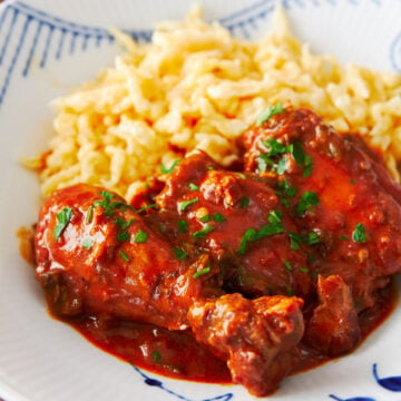 With fall-off-the-bone tender chicken stewed in a paprika and sour cream sauce, Chicken Paprikash (Paprikás Csirke) is a Hungarian classic that comes together from just a handful of ingredients.