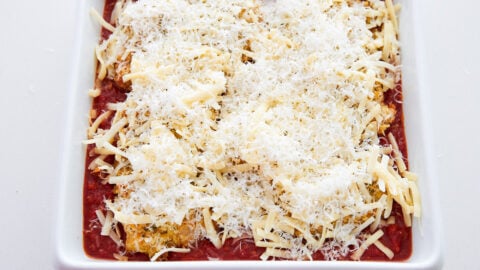 Cover the chicken parmesan with mozzarella and parmesan and bake.