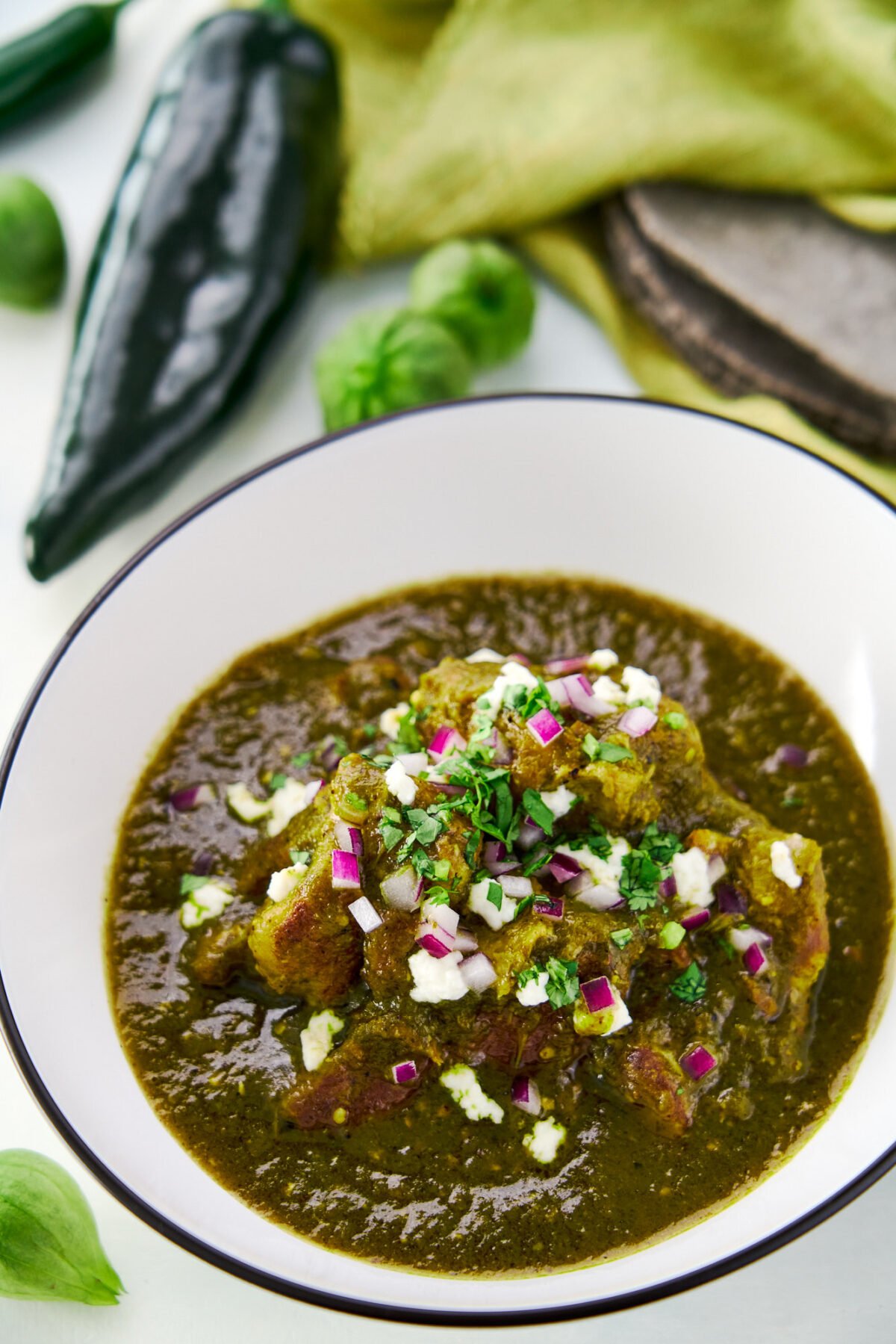 Made from scratch, this chili verde is loaded with char-grilled green chilies and tangy tomatillos simmered with big hunks of pork shoulder until they're fall-apart tender.