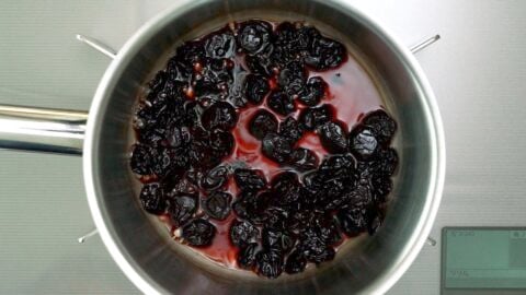 Rehydrating dried cherries in Cherry Heering for adding to brownies.