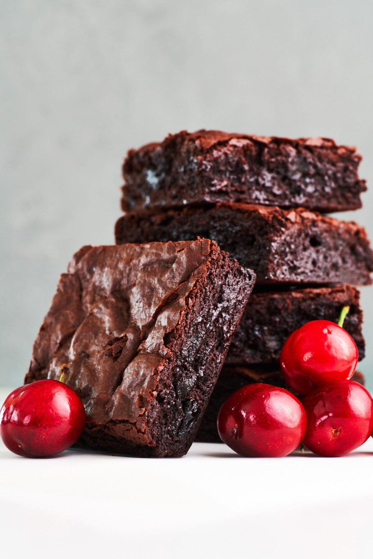 These perfect chocolate cherry brownies have a crisp shell on top and a decadent fudgy center, and they take less than 10 minutes to get in the oven.