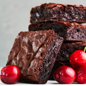 These perfect chocolate cherry brownies have a crisp shell on top and a decadent fudgy center, and they take less than 10 minutes to get in the oven.