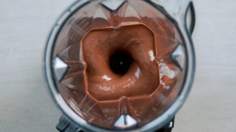 Creamy Chocolate Chia Pudding spinning in a blender.