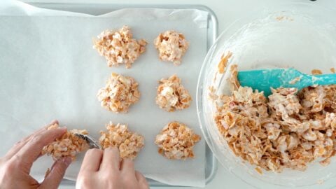 Shaping crispy peppermint bark into cookies.