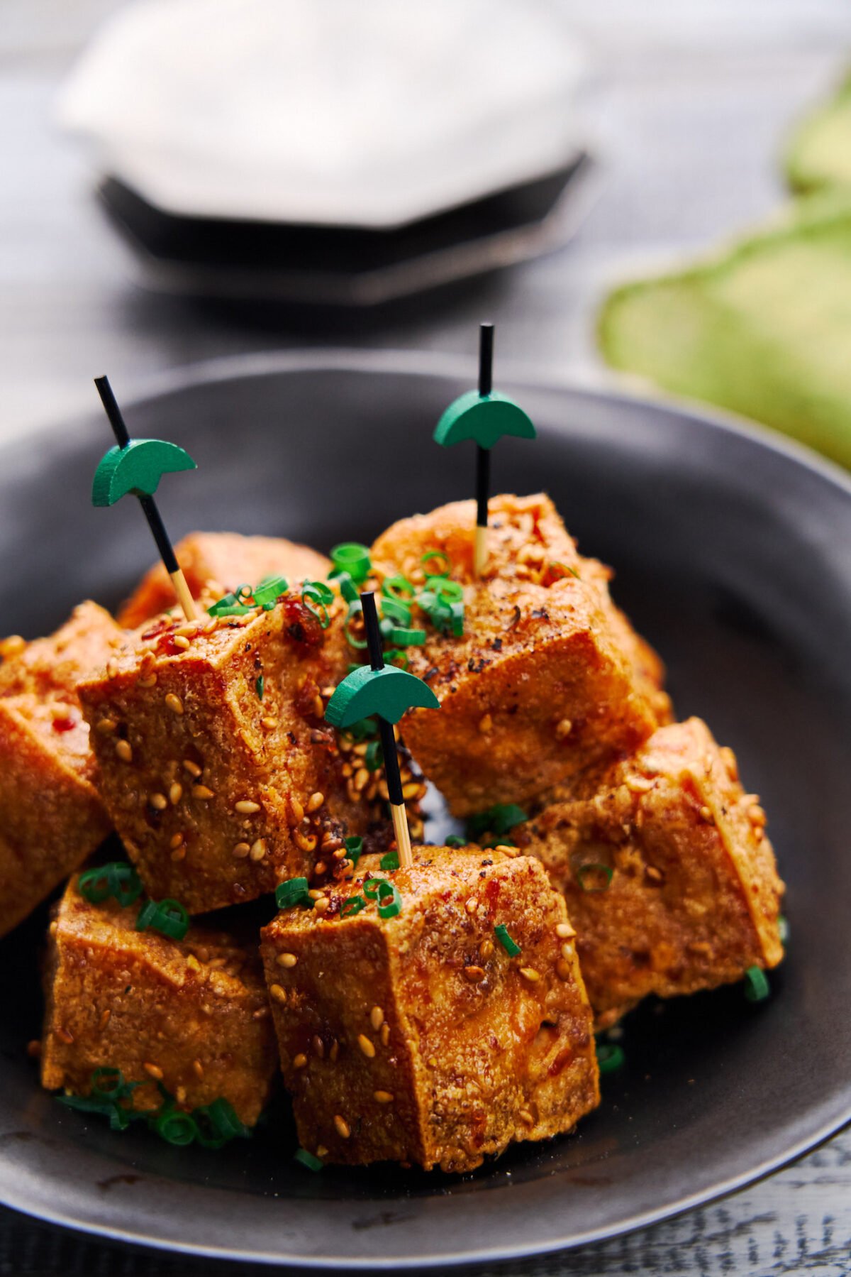 Ultra-crispy on the outside and tender and juicy on the inside these Crispy Tofu Bites are glazed with a savory sweet sauce that's loaded with ginger, garlic and black pepper. The perfect plant-based appetizer.