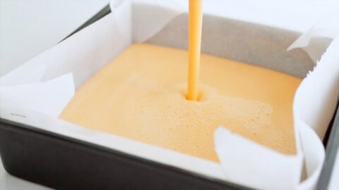 Datemaki batter being poured into prepared baking pan.