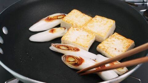 Browning scallions and tofu.