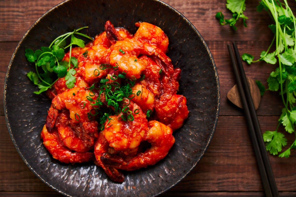 A plate of Japanese Ebi Chili (sweet and spicy shrimp) combines plump, juicy shrimp with a mildly spicy tomato and chili sauce.