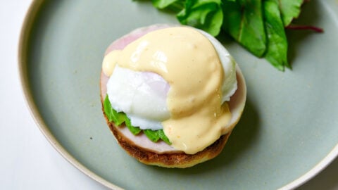 A blanket of Hollandaise sauce finishes off our Eggs Benedict.