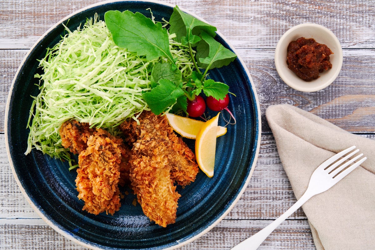 Kaki fry (Japanese Panko Fried Oysters) with a shredded cabbage salad and oroshi ponzu sauce.