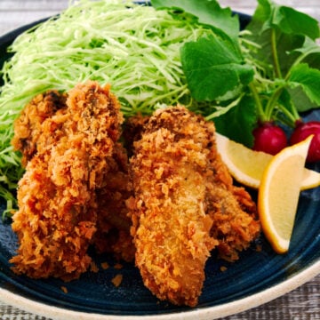 A plate of Kaki Fry, or Japanese Fried Oysters with an ultra-crispy panko crust and plump briny center.