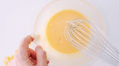 Whisking batter for deep fried oysters.