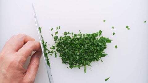 Chopping spinach leaves to add color to Furikake.