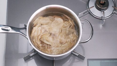 Blanching sliced young ginger.