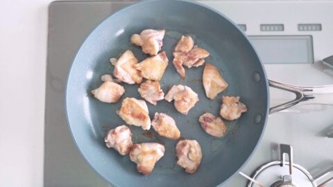 Pan-fried chicken thighs for ginger chicken bento.