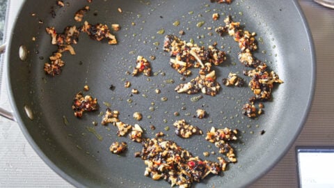 Fried garlic, black beans and doubanjiang (chili bean paste) for making green bean stir-fry.