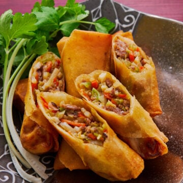 Japanese-style spring rolls, or harumaki, are filled with meat, veggies, mushrooms, and a savory sauce.