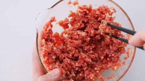 Marinating ground pork with soy sauce and mirin for Japanese-style spring rolls.