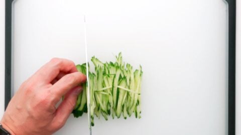 Cutting the cucumber into matchsticks for Hiyashi Chuka.