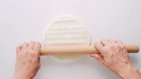 Pressing out udon dough.