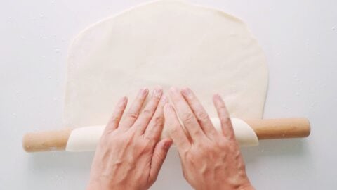 Udon dough rolled out using a rolling pin.