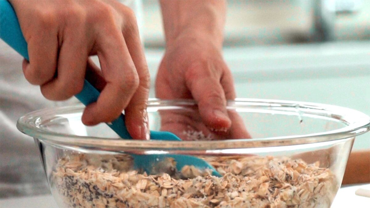 Mixing granola with spatula.