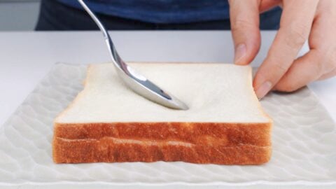 Press indentation into the bread to hold the egg.