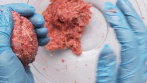 Shaping Japanese Hamburger Steaks between two hands.