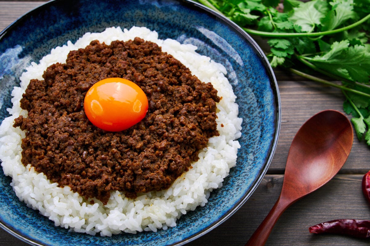 Intensely flavorful and only mildly spicy this Japanese-style ground meat dry curry is topped with a golden yolk.