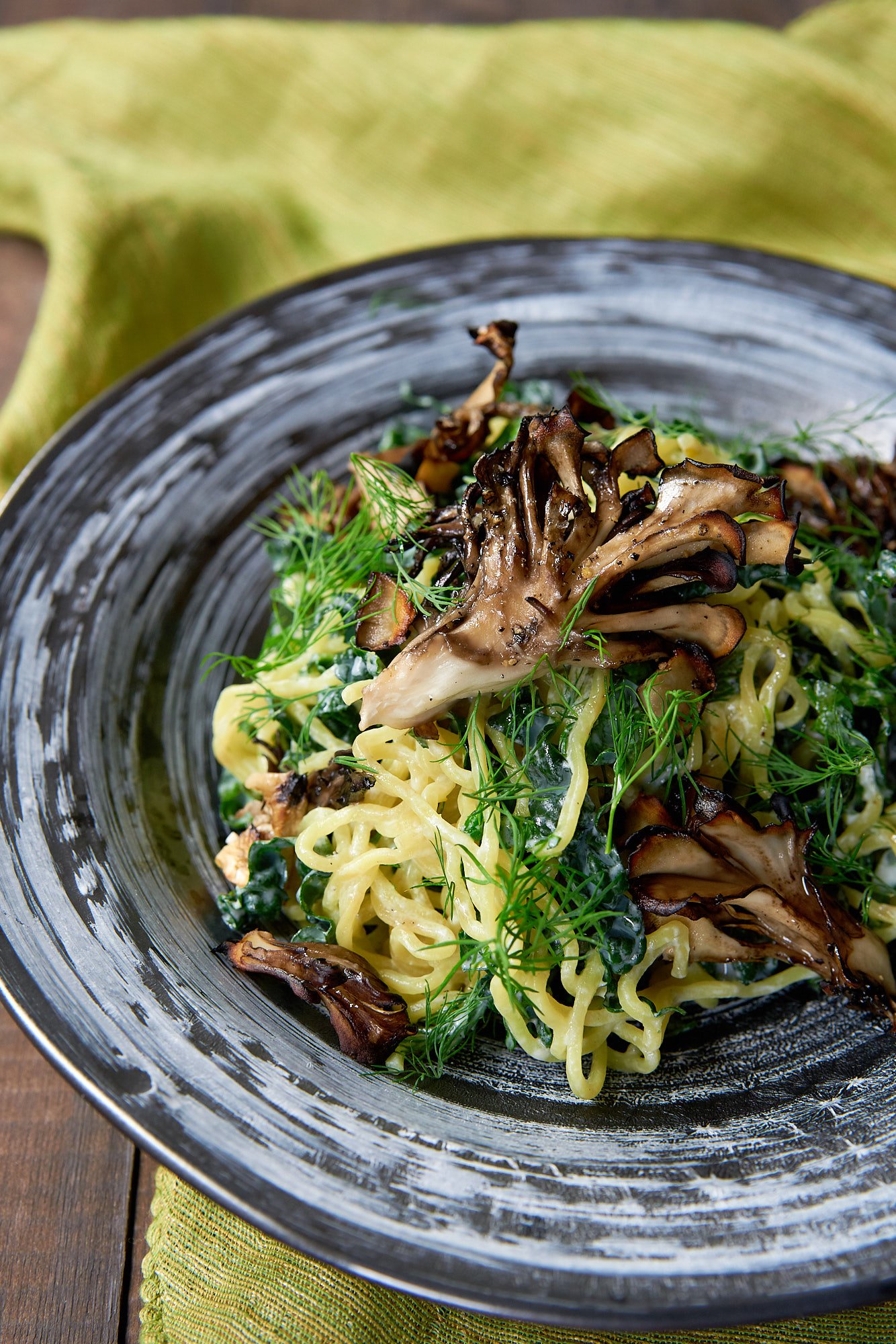 With a creamy garlic lemon sauce, curly ramen noodles, lacinato kale, dill and roasted maitake mushrooms, this salad makes for a delicious light meal.