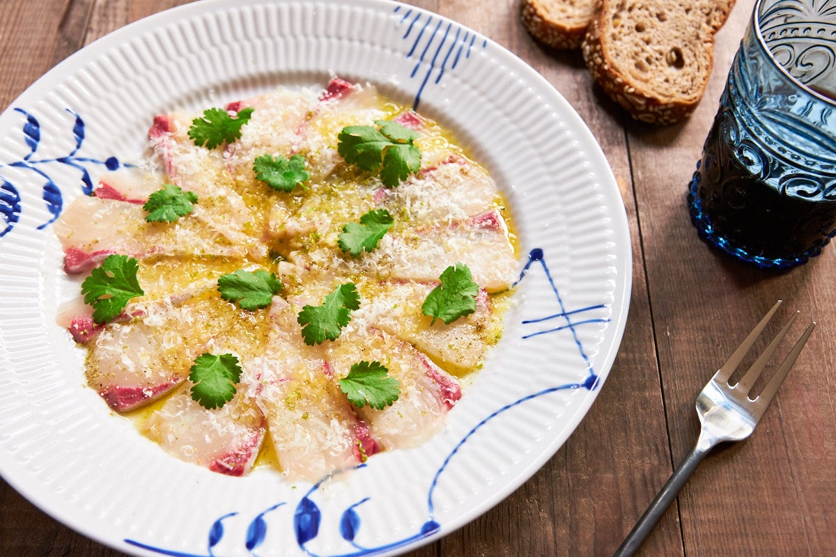 A simple Carpaccio made with paper thin slices of Kanpachi (Greater Amberjack) with olive oil, sea salt and Pecorino Romano.