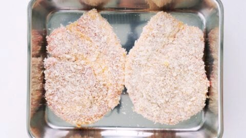 Breaded tonkatsu cutlets ready to fry.