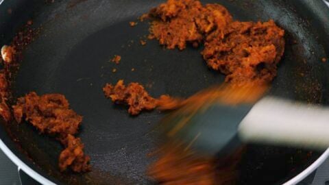 Toasting curry spices with caramelized aromatics.