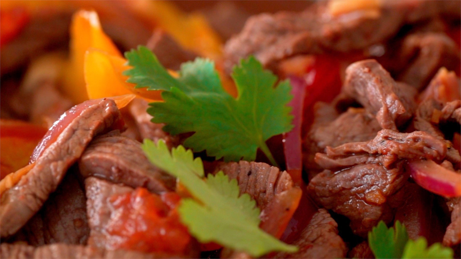 Lomo Saltado is a stir-fry of beef, peppers, tomatoes and onions.