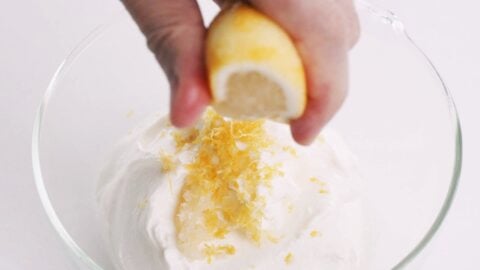 Squeezing lemon juice into bowl of Mentaiko Sauce.