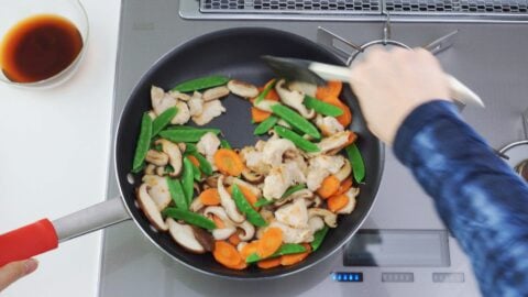 Add the snow peas and continue stir frying the Moo Goo Gai Pan