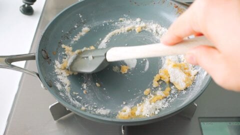 Cooking flour and butter roux in frying pan.