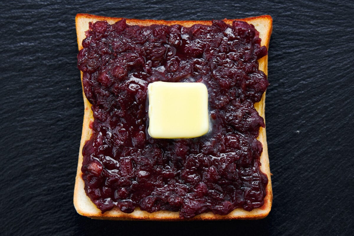 Ogura toast made with toasted japanese sandwich bread topped with sweet red bean paste and butter.