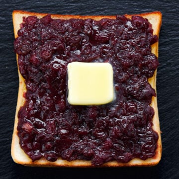 Ogura toast made with toasted japanese sandwich bread topped with sweet red bean paste and butter.